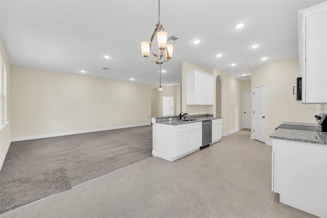 kitchen featuring white cabinetry, appliances with stainless steel finishes, hanging light fixtures, and light stone counters