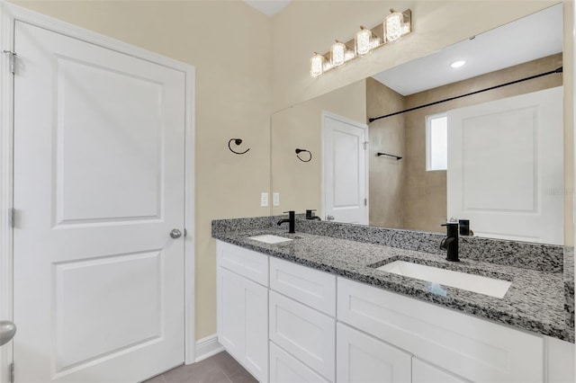 bathroom featuring vanity and tile patterned flooring