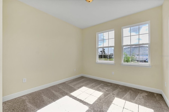 unfurnished room with carpet flooring