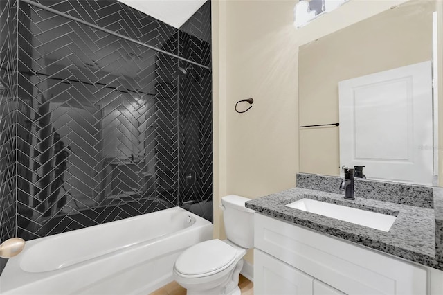 full bathroom with vanity, toilet, and tiled shower / bath combo