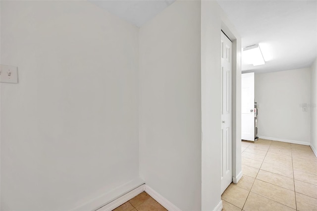 hallway with light tile patterned floors