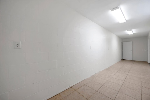 unfurnished room featuring light tile patterned floors