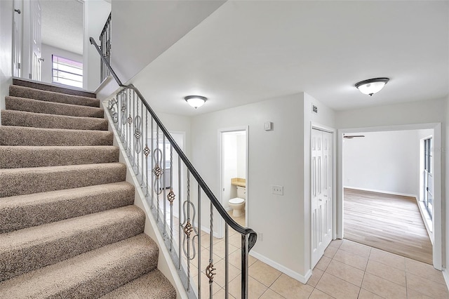 stairway featuring hardwood / wood-style floors