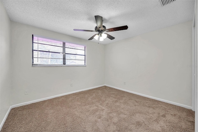 unfurnished room featuring carpet flooring, ceiling fan, and a textured ceiling