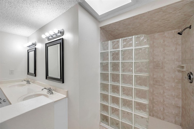 bathroom featuring vanity and tiled shower