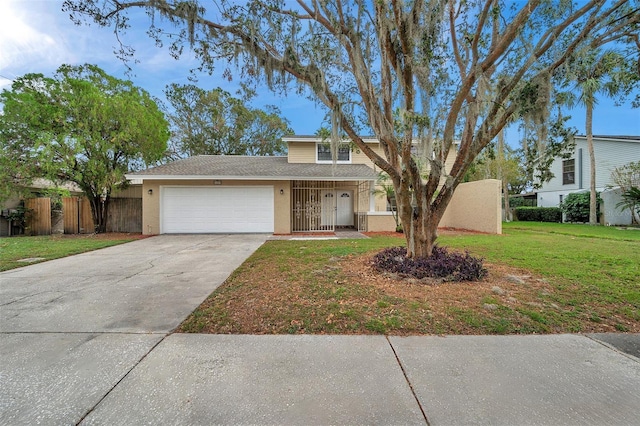 view of front of home featuring a front yard and a garage