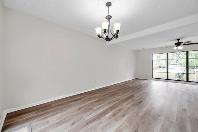 spare room featuring beam ceiling, light hardwood / wood-style floors, and ceiling fan with notable chandelier