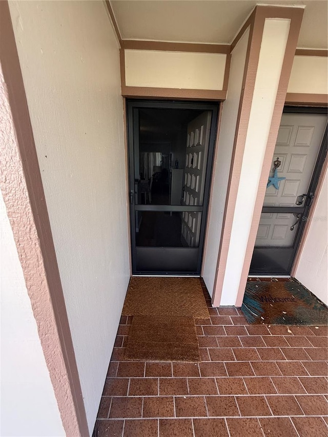 6268 Palma Del Mar Blvd S Unit 215, Saint Petersburg, FL 33715 - doorway to property with stucco siding