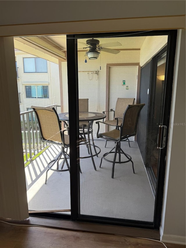 6268 Palma Del Mar Blvd S Unit 215, Saint Petersburg, FL 33715 - balcony with a ceiling fan and outdoor dining space
