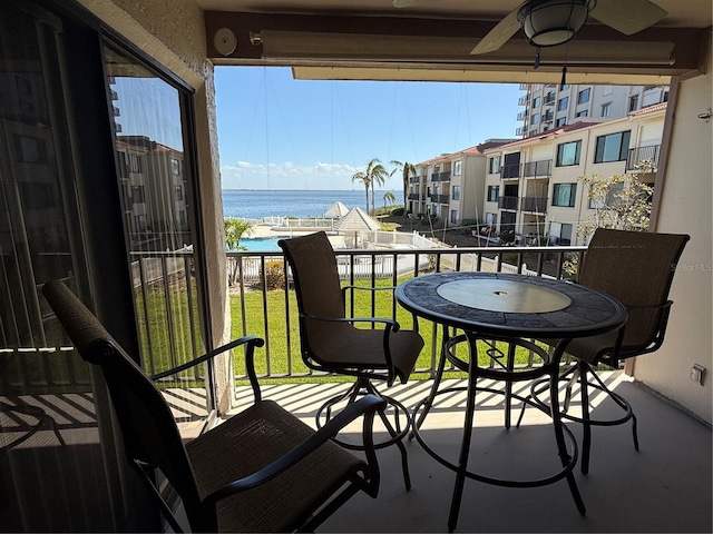 6268 Palma Del Mar Blvd S Unit 215, Saint Petersburg, FL 33715 - balcony featuring a water view, a ceiling fan, and a sunroom