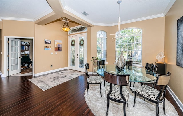 dining space featuring french doors, hardwood / wood-style floors, and ornamental molding