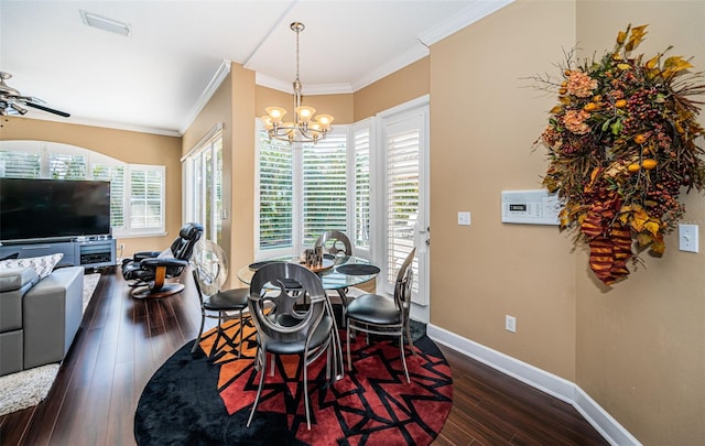 dining area featuring crown molding, dark hardwood / wood-style flooring, and ceiling fan with notable chandelier