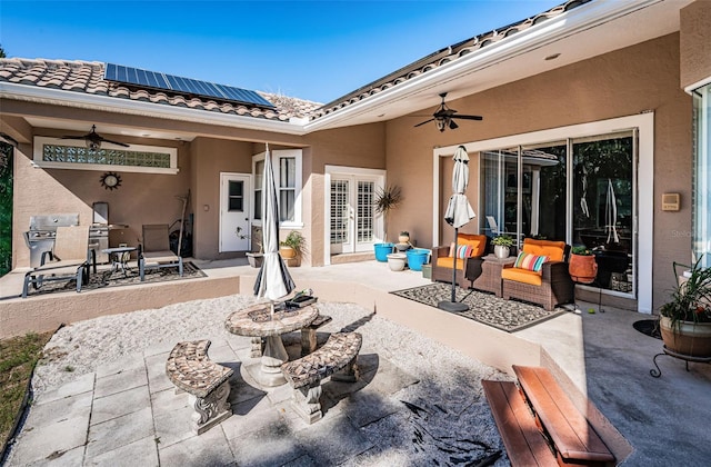 view of patio / terrace featuring french doors, ceiling fan, and a grill