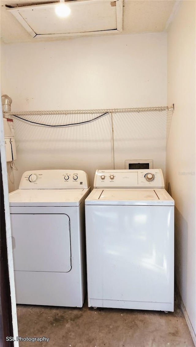 laundry area featuring washing machine and clothes dryer