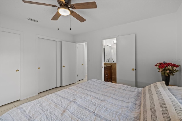 2516 Roberta St, Largo, FL 33771 - tiled bedroom with ensuite bathroom and a ceiling fan