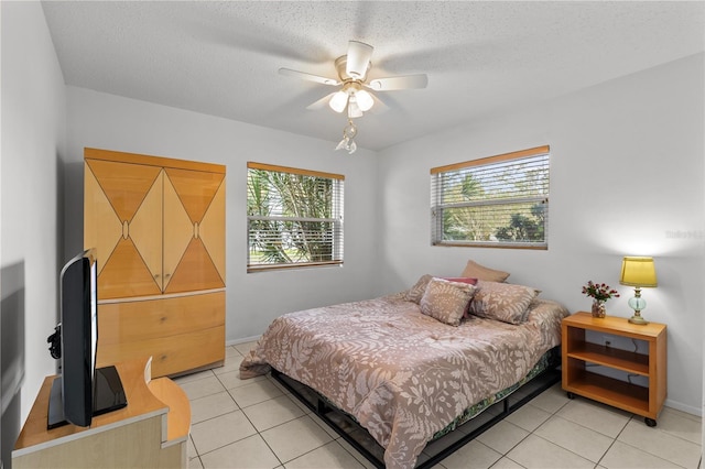 2516 Roberta St, Largo, FL 33771 - bedroom featuring light tile patterned floors, baseboards, and a ceiling fan