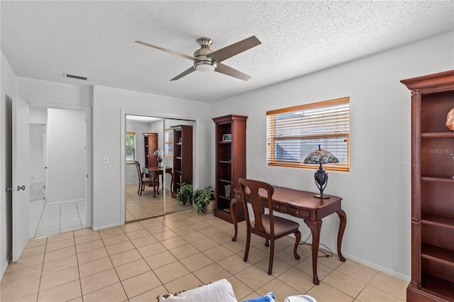 2516 Roberta St, Largo, FL 33771 - office space with a ceiling fan, plenty of natural light, light tile patterned flooring, a textured ceiling, and baseboards
