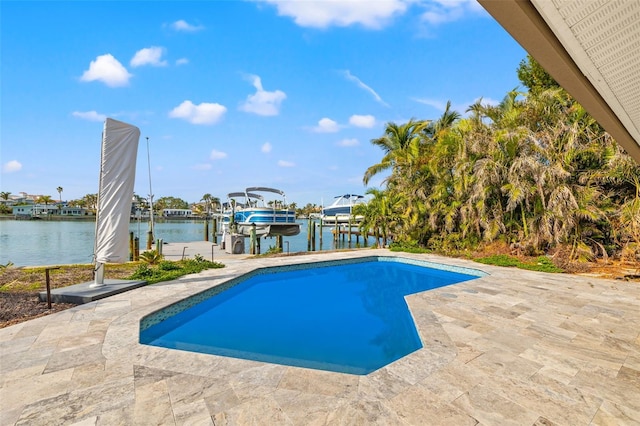 view of swimming pool featuring a water view and a dock