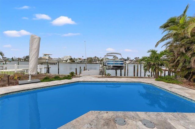 view of pool featuring a dock and a water view