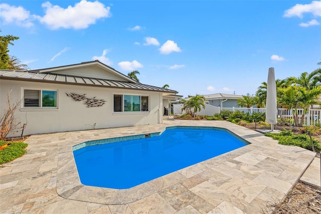 view of swimming pool featuring a patio area