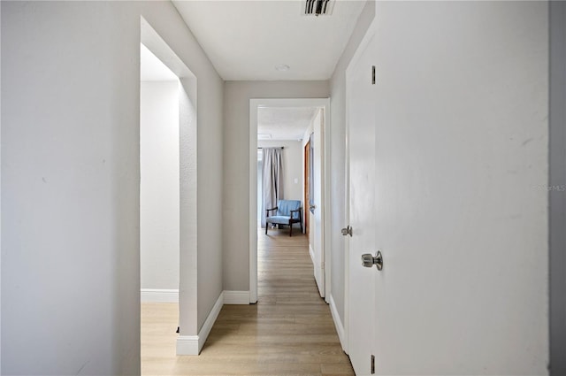 corridor featuring light hardwood / wood-style flooring