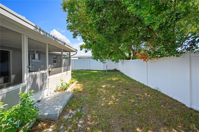 view of yard with a sunroom