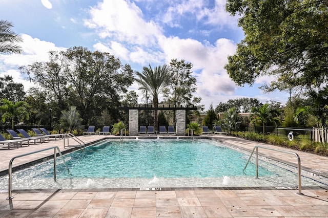 view of swimming pool with a patio