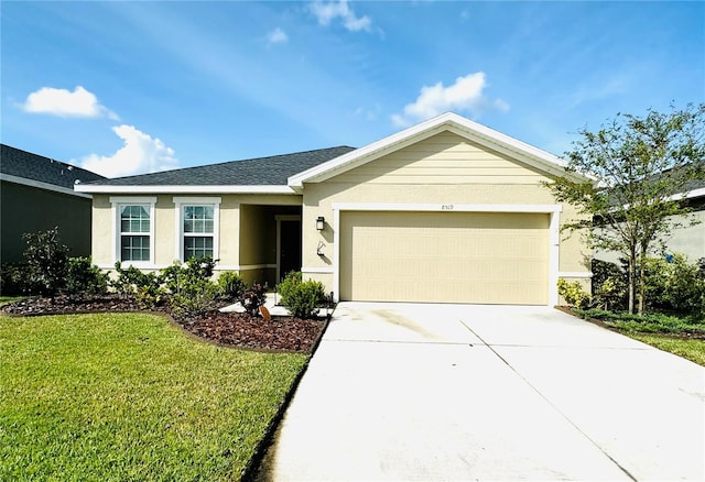 ranch-style home featuring a garage and a front lawn