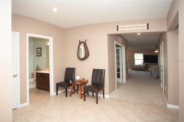 corridor with light tile patterned flooring