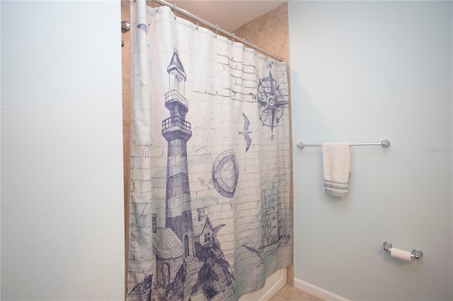 bathroom with a shower with shower curtain