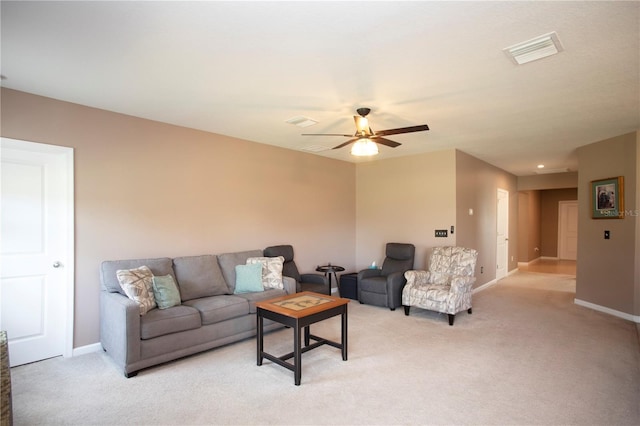 carpeted living room featuring ceiling fan