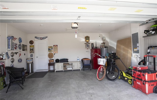 garage featuring electric panel, gas water heater, and a garage door opener