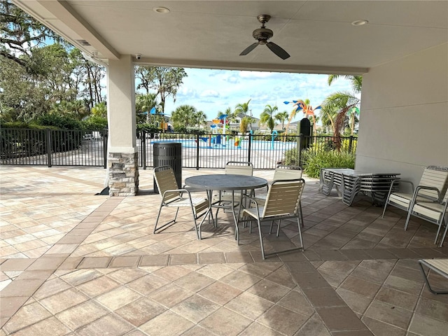 view of patio / terrace featuring ceiling fan and a community pool