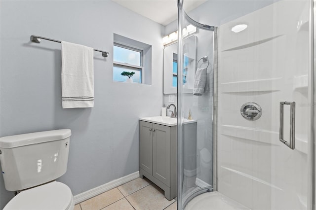 bathroom featuring tile patterned floors, toilet, an enclosed shower, and vanity