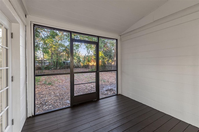 unfurnished sunroom with a wealth of natural light and lofted ceiling