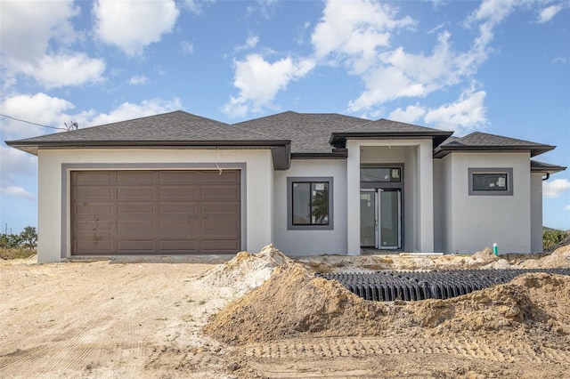 prairie-style home with a garage