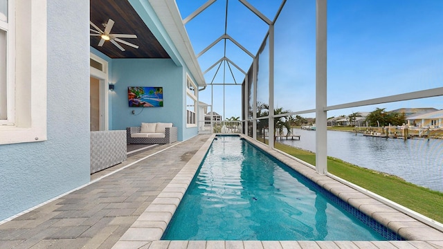 view of pool with a patio area and ceiling fan