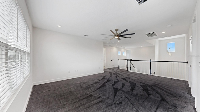 carpeted empty room featuring ceiling fan