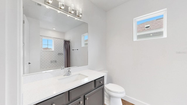 bathroom with a shower with curtain, vanity, toilet, and wood-type flooring