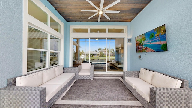 living room with ceiling fan and wooden ceiling