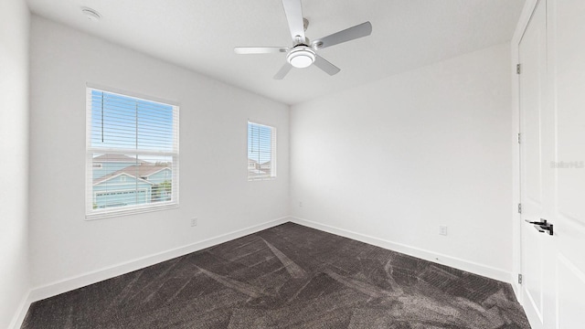 unfurnished room featuring carpet and ceiling fan