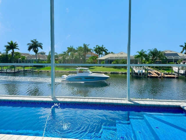 view of pool with a water view