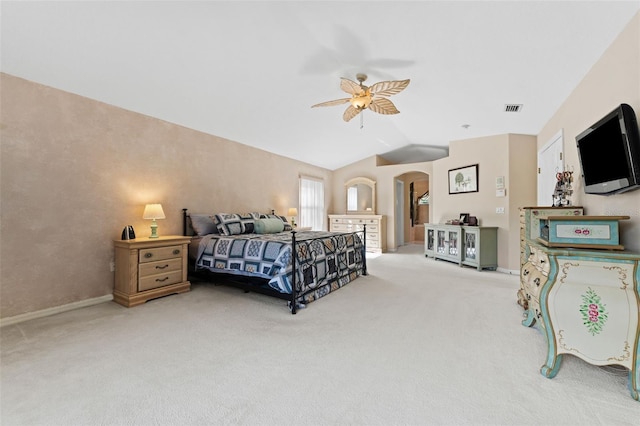 bedroom with vaulted ceiling, ceiling fan, and carpet floors