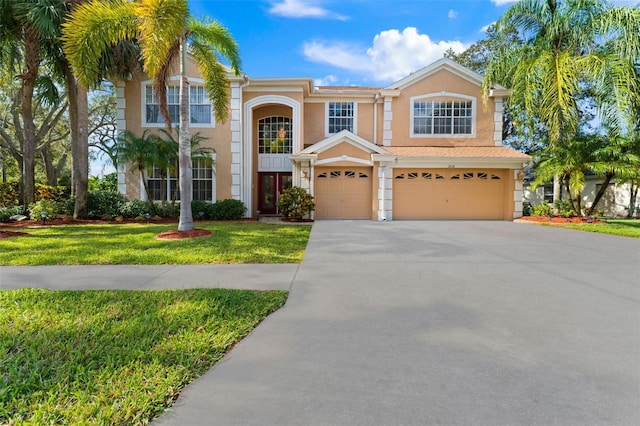 view of front facade featuring a front lawn and a garage