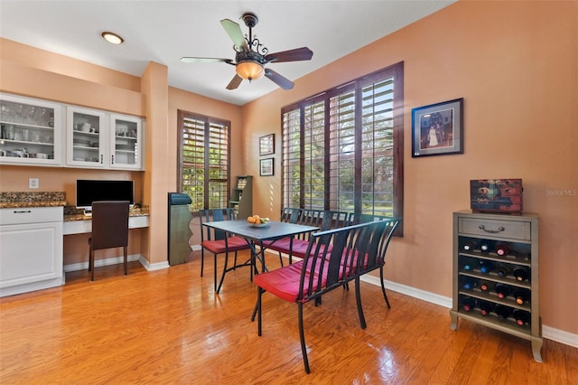 dining room featuring ceiling fan and light hardwood / wood-style flooring