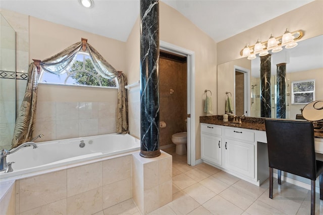 bathroom with lofted ceiling, tile patterned floors, vanity, toilet, and a relaxing tiled tub