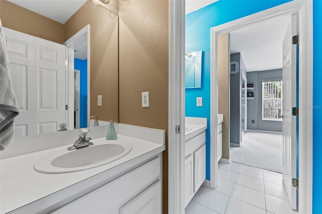 bathroom with vanity and tile patterned floors