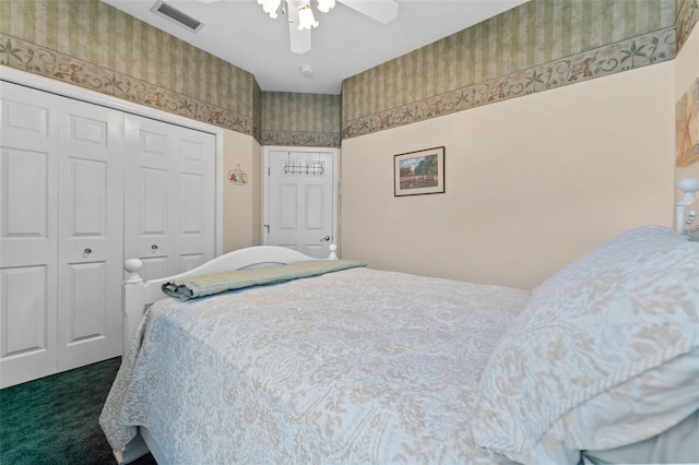 bedroom featuring ceiling fan, a closet, and dark carpet