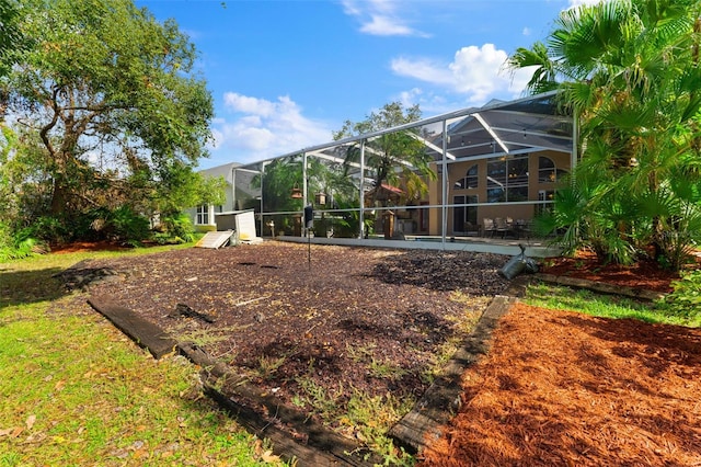 view of yard featuring a lanai