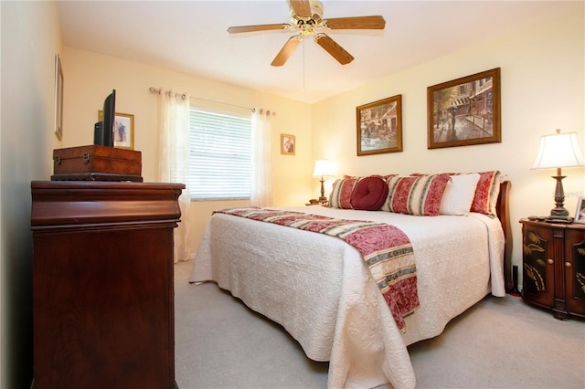 bedroom featuring ceiling fan and light colored carpet